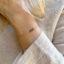 Smoky quartz bracelet worn with a cream sweater