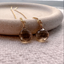 Smoky quartz threader earrings in 14k gold-filled on a stone dish