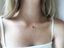 Smoky quartz teardrop necklace worn with a white camisole