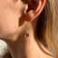 Smoky quartz threader earring worn in natural light