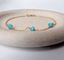 14k gold-filled turquoise station bracelet with spring ring clasp in a stone dish