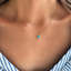 Gold filled turquoise teardrop necklace worn with a striped top, December birthstone - Lolabean