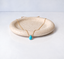 Gold filled turquoise teardrop necklace on a terrazzo dish - Lolabean