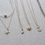 14k gold filled charm necklace collection starfish anchor sun heart pendant options on natural linen