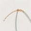 Paperclip extender and clasp detail of aquamarine necklace with small pearl accent