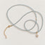 Long aquamarine beaded necklace arranged in loops with mother-of-pearl pendant and pearl accents