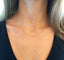 Minimal cubic zirconia station necklace layered at the collarbone