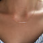 Close-up of faceted Peruvian pink opal beads on a gold chain