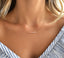 Pink opal beaded bar necklace in gold filled worn with a striped blouse
